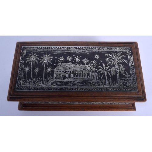 410 - A FINE 19TH CENTURY ANGLO INDIAN SILVERED STEEL AND HARDWOOD CASKET decorated with elephants and lan... 