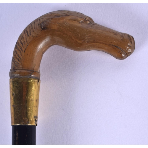 415 - A VERY RARE 19TH CENTURY CONTINENTAL CARVED RHINOCEROS HORN HORSE HEAD WALKING CANE. 68 cm long.