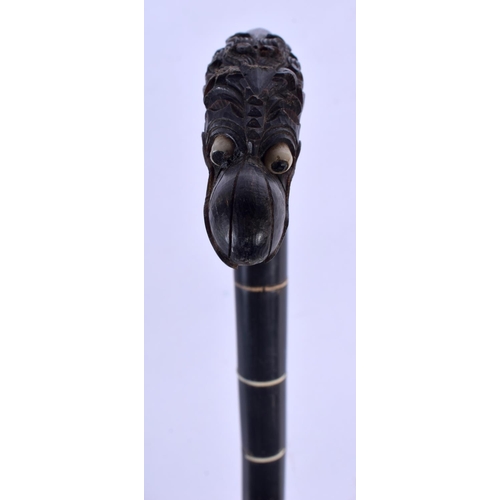 418 - A VERY RARE 19TH CENTURY MIDDLE EASTERN CARVED FULL LENGTH RHINOCEROS HORN WALKING CANE with stylise... 