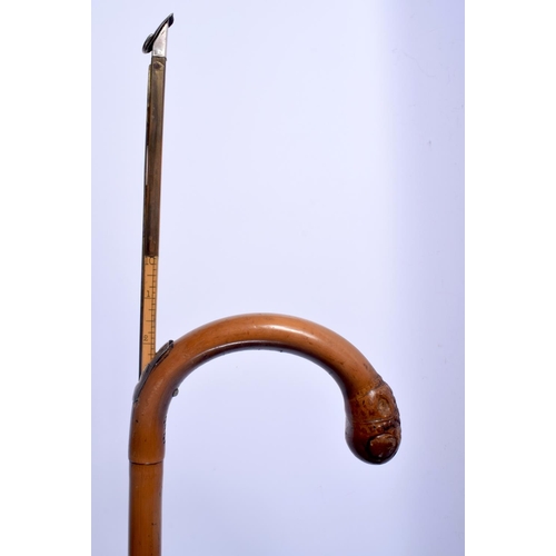 422 - AN ANTIQUE SILVER MOUNTED BAMBOO HORN MEASURING STICK. 92 cm long.