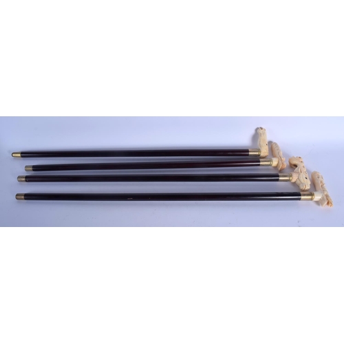 433 - FOUR CONTINENTAL CARVED BONE WALKING CANES with ebonised shafts. Largest 95 cm long. (4)