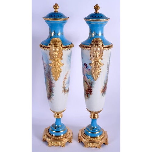 46 - A LARGE PAIR OF CONTINENTAL SEVRES STYLE PORCELAIN VASES AND COVERS painted with figures within land... 