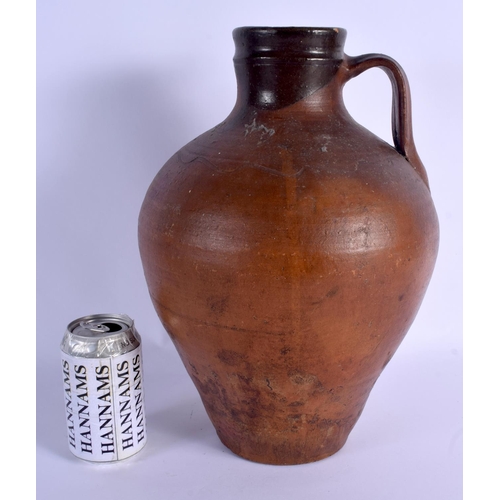 48 - A LARGE 18TH/19TH CENTURY ENGLISH STONEWARE PITCHER with simple scrafito decoration. 37 cm high.