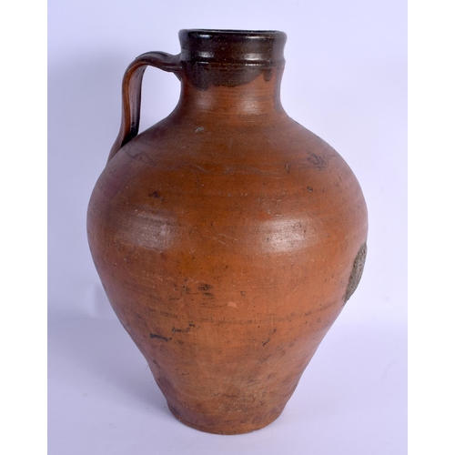 48 - A LARGE 18TH/19TH CENTURY ENGLISH STONEWARE PITCHER with simple scrafito decoration. 37 cm high.