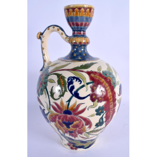 56 - AN ANTIQUE HUNGARIAN ZSOLNAY PECS POTTERY EWER painted with stylised flowers and vines. 32 cm high.