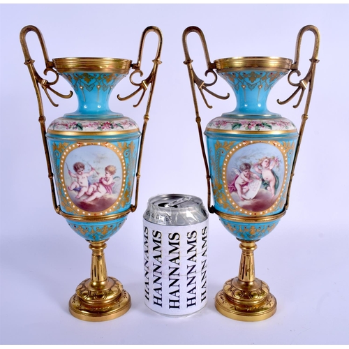 65 - A PAIR OF 19TH CENTURY FRENCH SEVRES PORCELAIN VASES painted and jewelled with putti in various purs... 