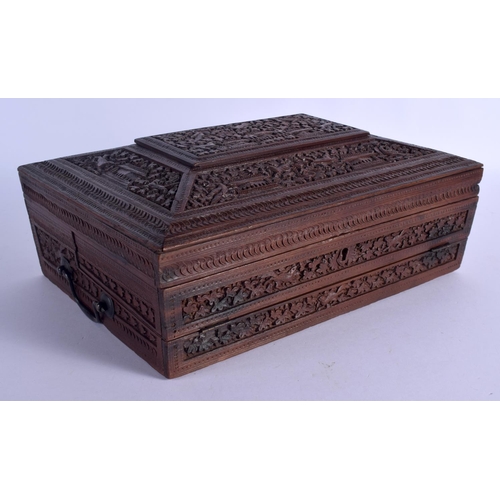 664 - A 19TH CENTURY ANGLO INDIAN CARVED SANDALWOOD WRITING BOX AND COVER with fitted slope. 32 cm x 22 cm... 