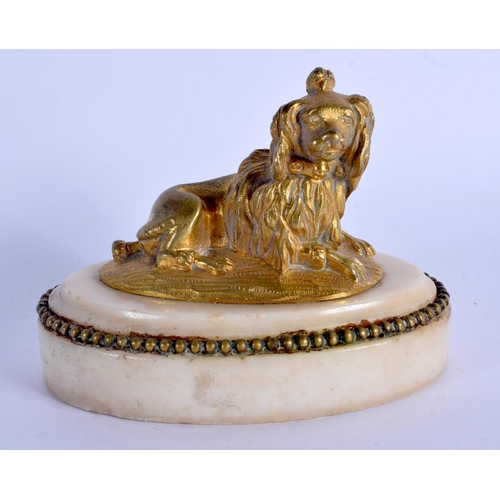 674 - A 19TH CENTURY EUROPEAN GILT BRONZE FIGURE OF A DOG upon a marble base. 10 cm x 8 cm.