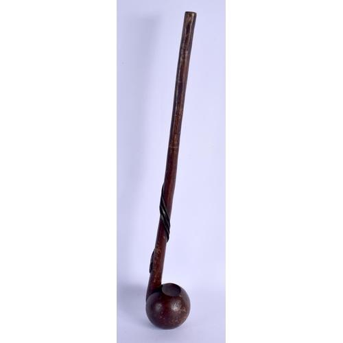 678 - AN UNUSUAL POLYNESIAN CARVED TRIBAL HARDWOOD CLUB of pipe like form with entwined shaft. 52 cm long.