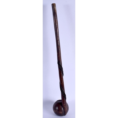 678 - AN UNUSUAL POLYNESIAN CARVED TRIBAL HARDWOOD CLUB of pipe like form with entwined shaft. 52 cm long.