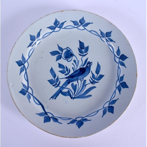 73 - AN 18TH CENTURY EUROPEAN DELFT BLUE AND WHITE PLATE painted with a bird and flowers. 21 cm diameter.