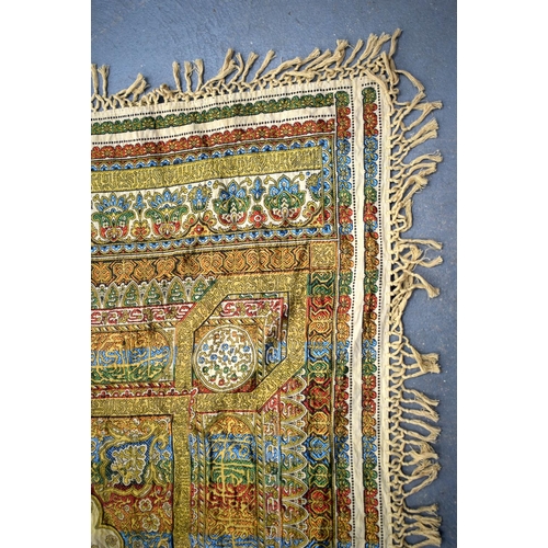 749B - A LARGE VINTAGE MIDDLE EASTERN EMBROIDERED SILK WALL HANGING. 179 cm x 240 cm.