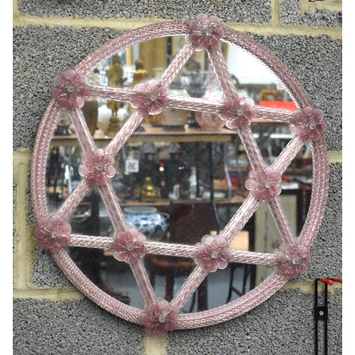 749C - A 1930S VENETIAN PINK GLASS MIRROR. 50 cm wide.