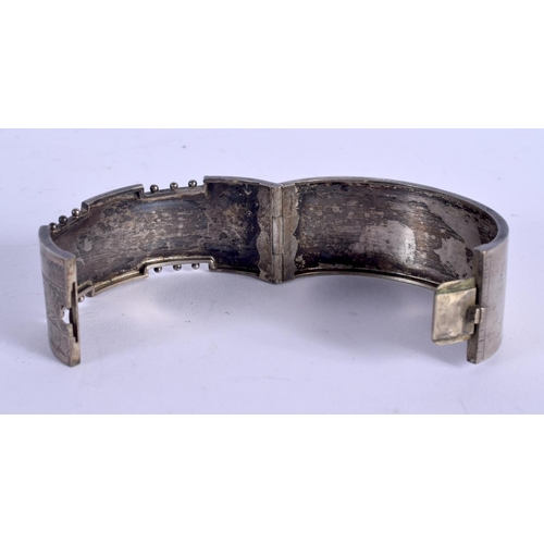 1007 - A VICTORIAN AESTHETIC MOVEMENT WHITE METAL BANGLE. 22 grams. 6 cm wide.