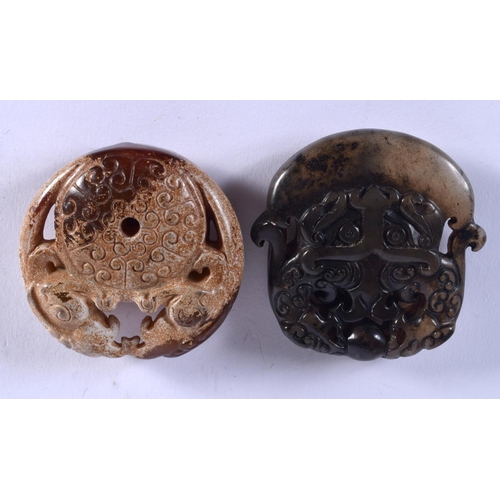 1017 - TWO CHINESE JADE ROUNDELS 20th Century. 4 cm x 5 cm. (2)