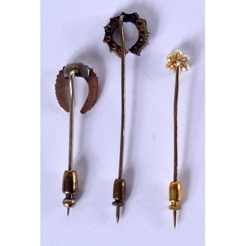 1027 - THREE ANTIQUE GOLD STICK PINS. 4 grams. (3)