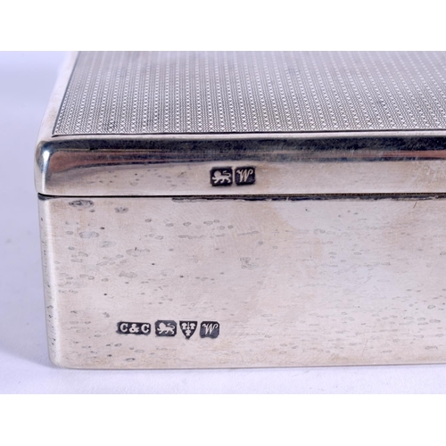 1032 - AN ART DECO SILVER CIGARETTE BOX. Chester 1922. 302 grams overall. 13 cm x 9 cm.