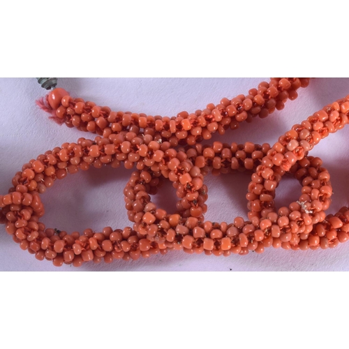 1053 - A 1930S CORAL BELT. 45 grams. 67 cm long.