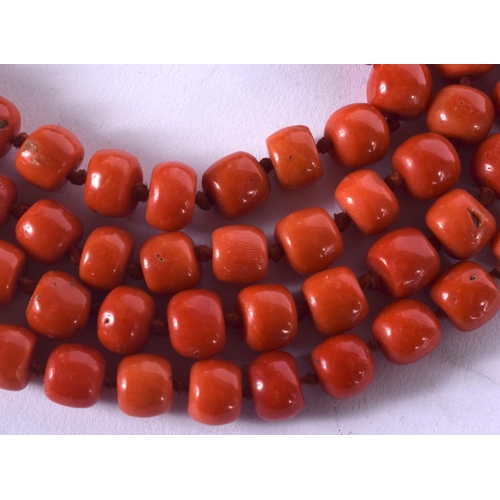 1059 - AN 18CT GOLD EUROPEAN AND CORAL NECKLACE. 150 grams. Each strand 122 cm long.