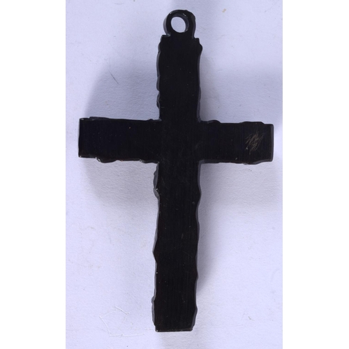 1063 - AN ANTIQUE IRISH BOG OAK CROSS. 10 cm x 5.5 cm.