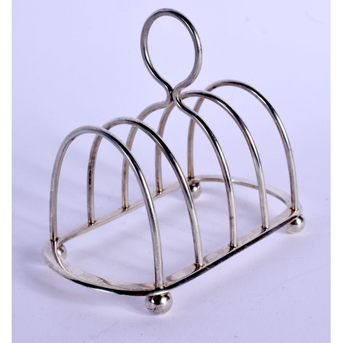 1070 - AN EDWARDIAN SILVER TOAST RACK. 66 grams. 10 cm wide.