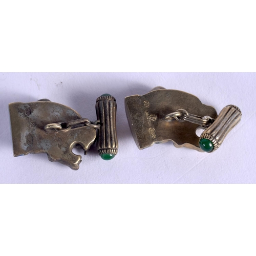 1085 - A PAIR OF CONTINENTAL SILVER AND ENAMEL GEM SET DOG CUFFLINKS. 2.5 cm wide.