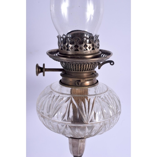 1093 - AN ANTIQUE SILVER PLATED OIL LAMP. 45 cm high not inc funnel.