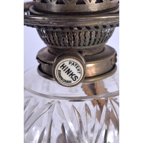 1093 - AN ANTIQUE SILVER PLATED OIL LAMP. 45 cm high not inc funnel.