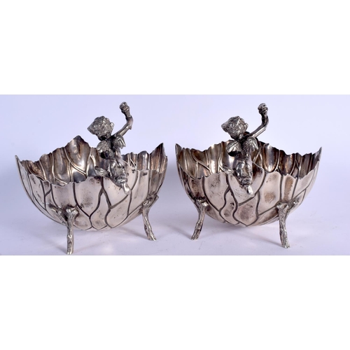 1105 - A PAIR OF EARLY 20TH CENTURY SILVER CHERUB BOWLS formed as open flowers. 640 grams. 13 cm x 15 cm.