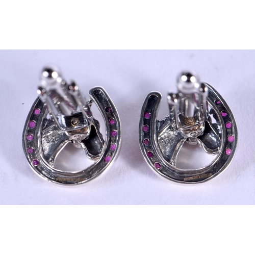 1113 - A PAIR OF SILVER HORSE HEAD CUFFLINKS. 11 grams. 2 cm x 1.5 cm.