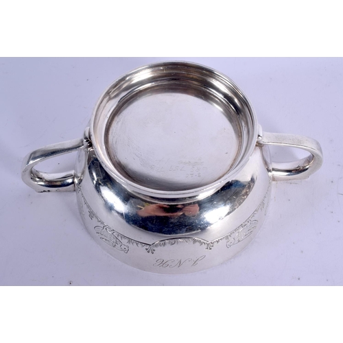 1126 - AN ART DECO TWIN HANDLED SILVER FEEDING BOWL decorated with fowl. Birmingham 1942. 264 grams. 5 cm x... 