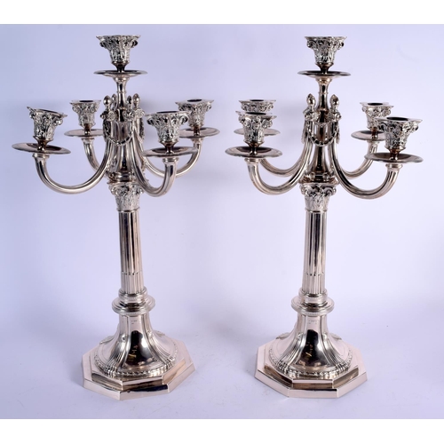 1156 - A LARGE ARTS AND CRAFTS SILVER CANDELABRA decorated with motifs. 3180 kgs. 59 cm x 37 cm.