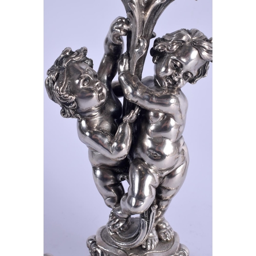 1157 - A LOVELY PAIR OF CONTINENTAL SILVER CANDLEABRA modelled two cherubs holding aloft floral capped scon... 