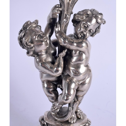 1157 - A LOVELY PAIR OF CONTINENTAL SILVER CANDLEABRA modelled two cherubs holding aloft floral capped scon... 