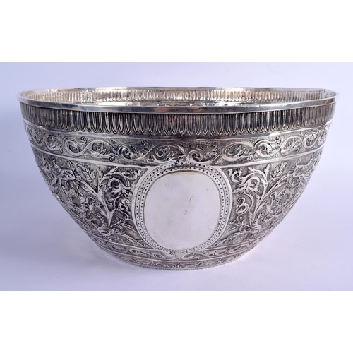 1183 - A VERY LARGE 19TH CENTURY INDIAN SILVER EMBOSSED BOWL of massive proportions. 2348 grams. 42 cm x 21... 