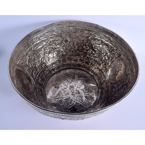 1183 - A VERY LARGE 19TH CENTURY INDIAN SILVER EMBOSSED BOWL of massive proportions. 2348 grams. 42 cm x 21... 