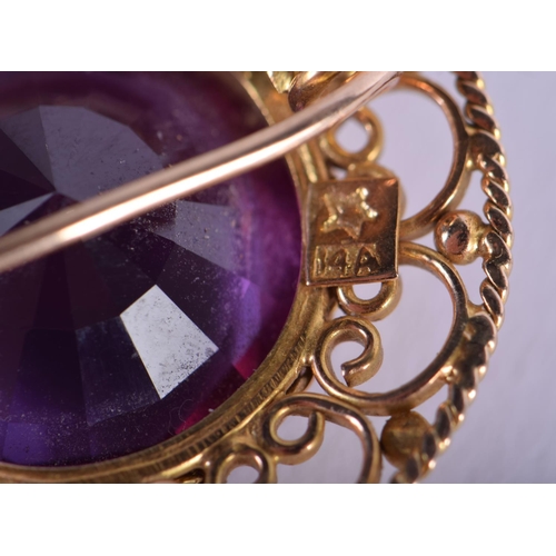 1197 - A 1970S 14CT GOLD AND AMETHYST BROOCH. 10 grams. 3 cm wide.