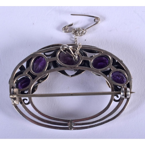 1219 - A VINTAGE SILVER AND AMETHYST BROOCH. 12 grams. 4.5 cm x 3.5 cm.