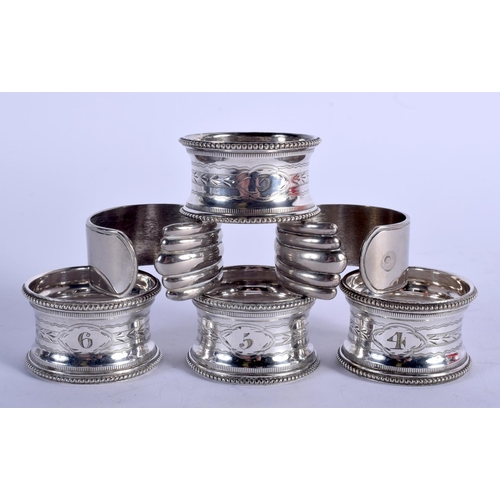 1222 - FOUR NAPKIN RINGS and two napkin holders. 183 grams. (6)