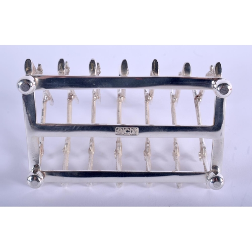 1225 - A SILVER PLATED RIFLE TOAST RACK. 11 cm x 5 cm.