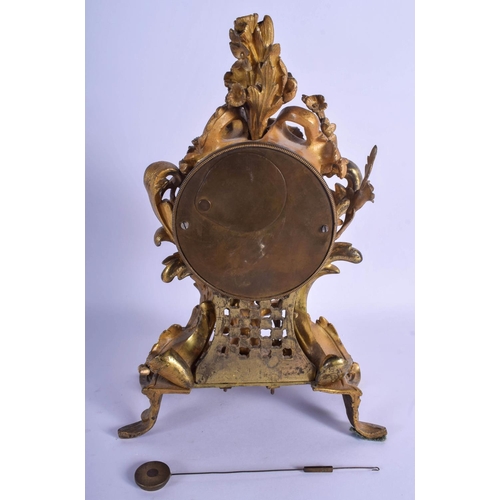 1484 - A MID 19TH CENTURY FRENCH ORMOLU MANTEL CLOCK modelled as a young boy emerging from a landscape, upo... 