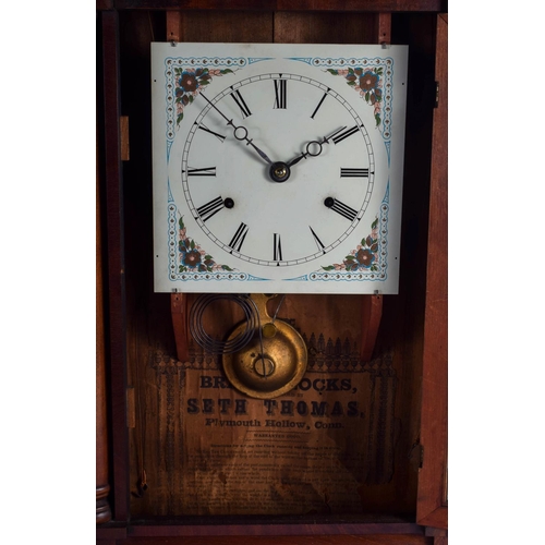 1489 - AN ANTIQUE REVERSE PAINTED AMERICAN WALL CLOCK. 62 cm x 32 cm.