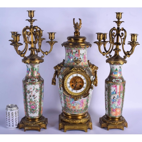 1492 - A RARE 19TH CENTURY CHINESE CANTON FAMILLE ROSE CLOCK GARNITURE Qing, painted with figures in variou... 