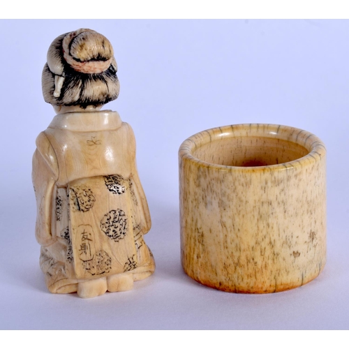 1505 - A 19TH CENTURY JAPANESE MEIJI PERIOD CARVED IVORY OKIMONO together with a Chinese bone archers ring.... 