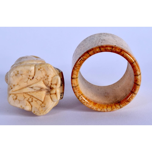 1505 - A 19TH CENTURY JAPANESE MEIJI PERIOD CARVED IVORY OKIMONO together with a Chinese bone archers ring.... 