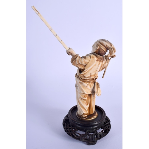 1513 - A 19TH CENTURY JAPANESE MEIJI PERIOD CARVED IVORY OKIMONO modelled holding a long stick. Ivory 16.5 ... 