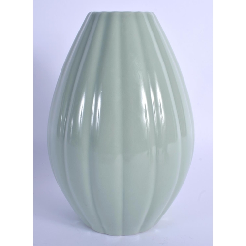 1531 - A CHINESE CELADON RIBBED VASE 20th Century, bearing Qianlong marks to base. 24 cm high.