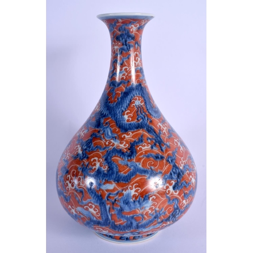 1539 - A 19TH CENTURY CHINESE BLUE AND WHITE PORCELAIN VASE Qing, painted with dragons amongst coral colour... 