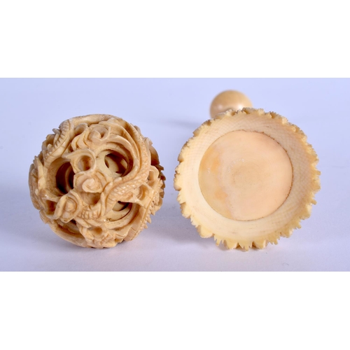 1549 - A 19TH CENTURY CHINESE CARVED CANTON IVORY PUZZLE BALL ON STAND. 15 cm x 3 cm.