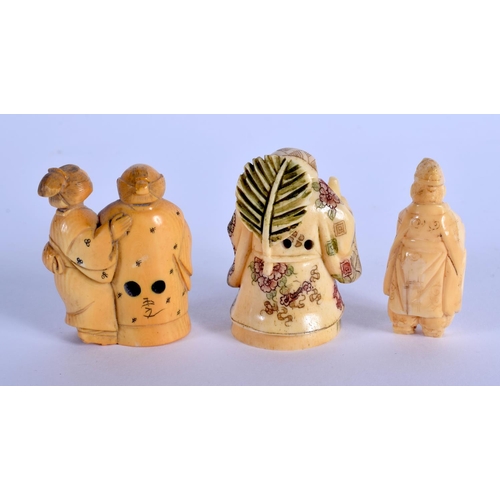 1553 - A 19TH CENTURY JAPANESE MEIJI PERIOD CARVED IVORY NETSUKE together with two others. Largest 5.5 cm x... 